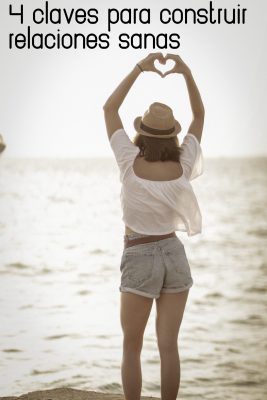 woman-standing-on-beach-showing-heart-sign-2918563 woman-standing-on-beach-showing-heart-sign-2918563